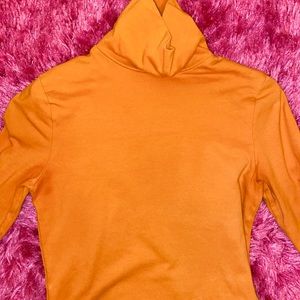 orange turtle neck